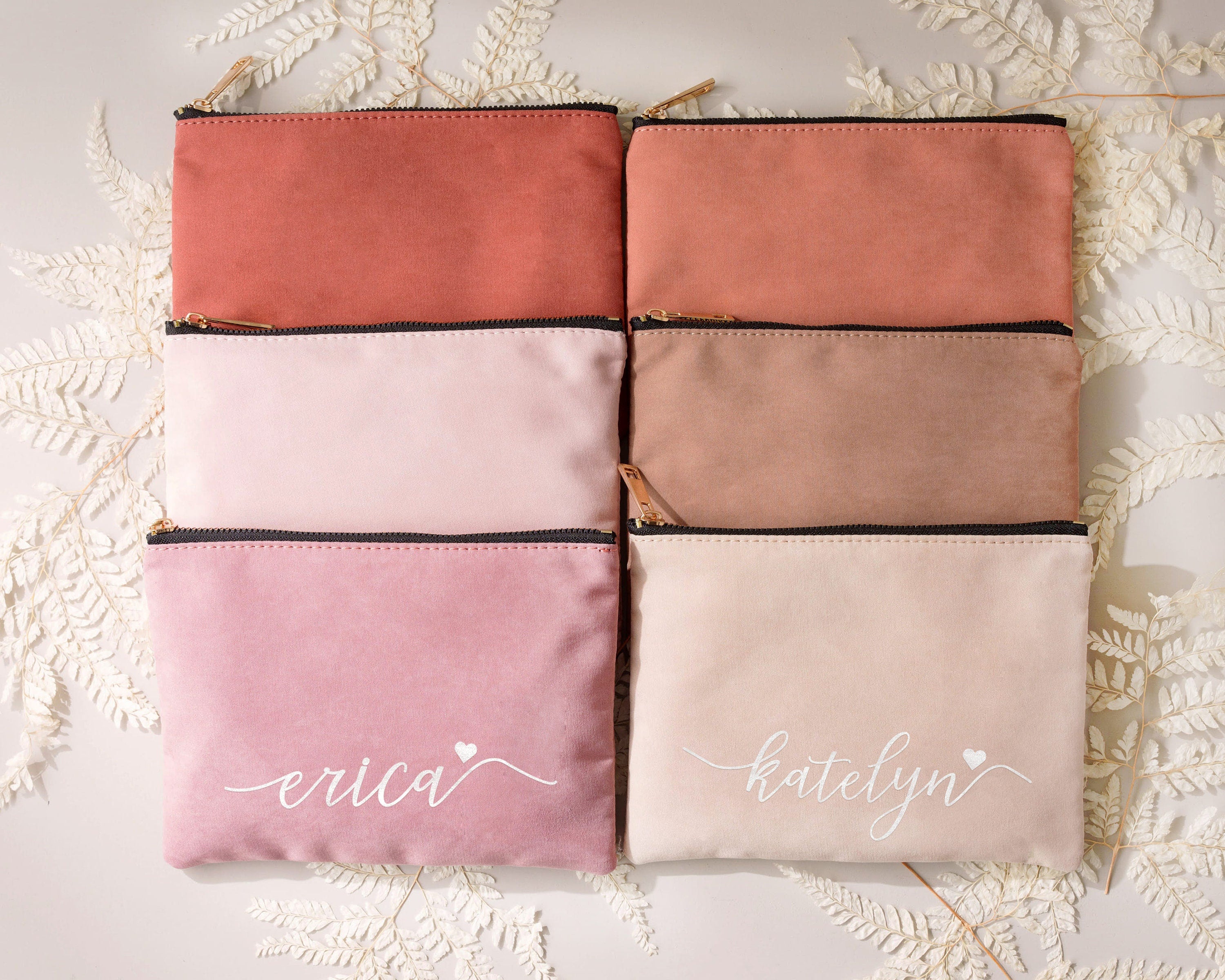 a set of four personalized makeup bags