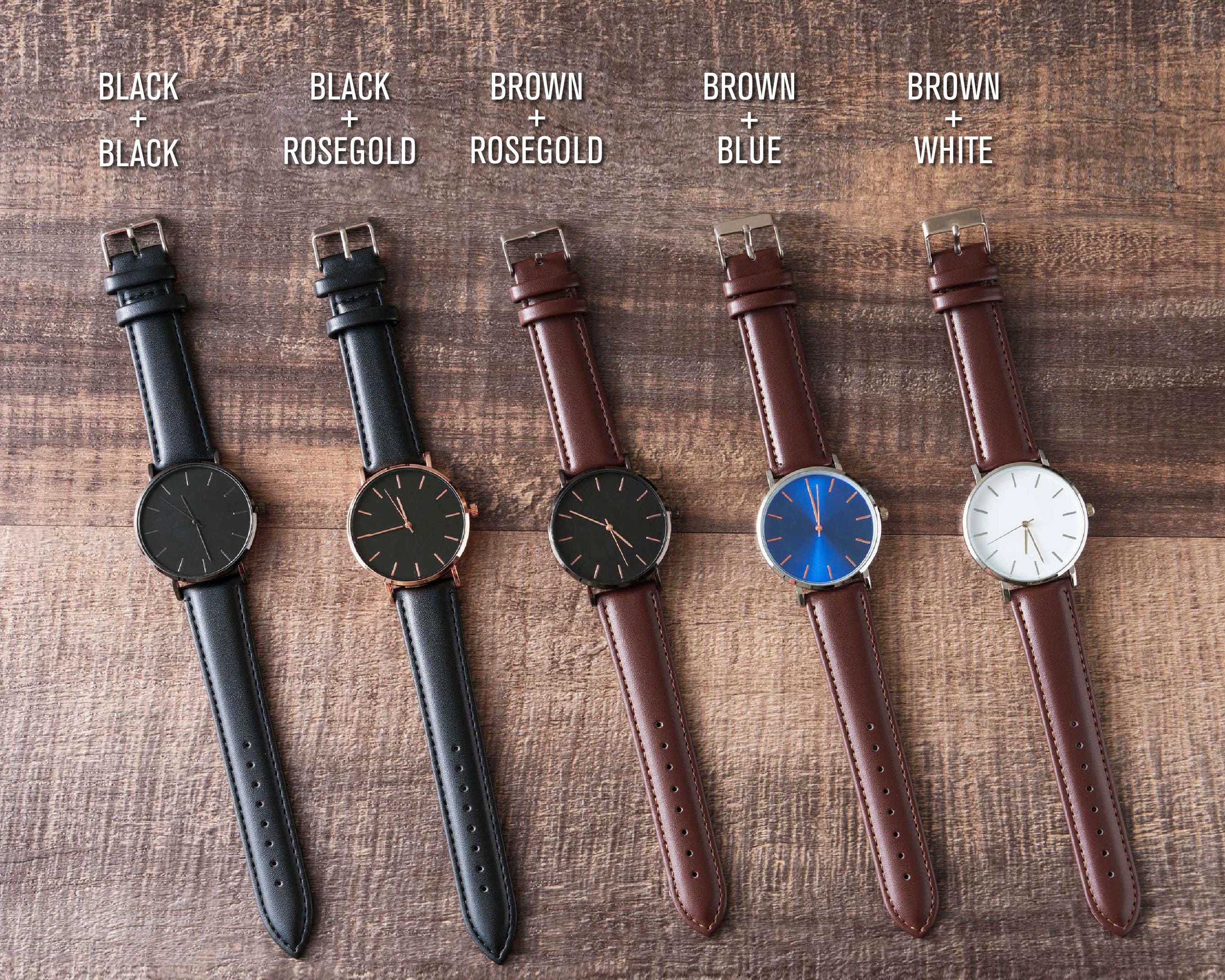 four different styles of watches sitting on a table