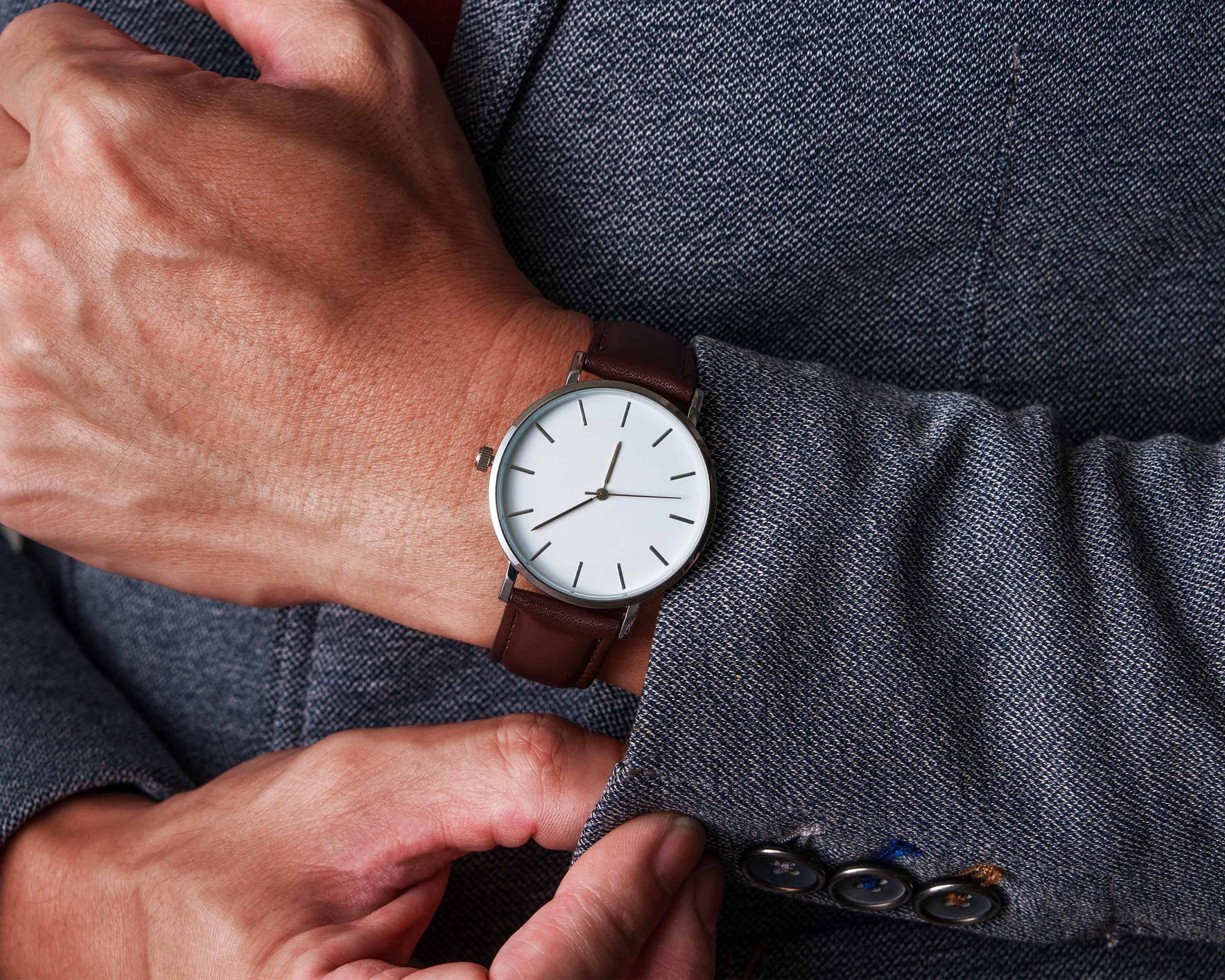 a close up of a person wearing a watch