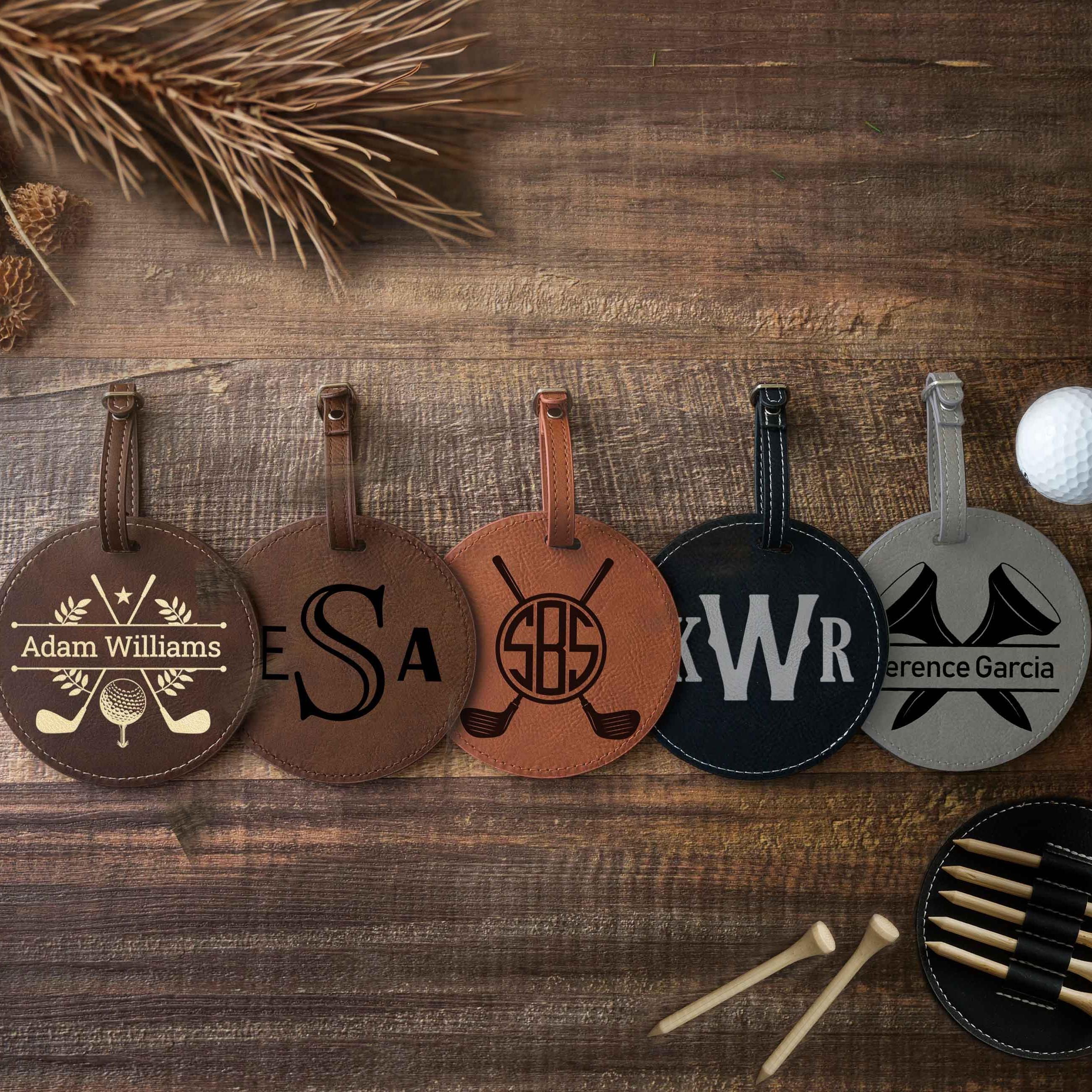 a group of golf tags sitting on top of a wooden table